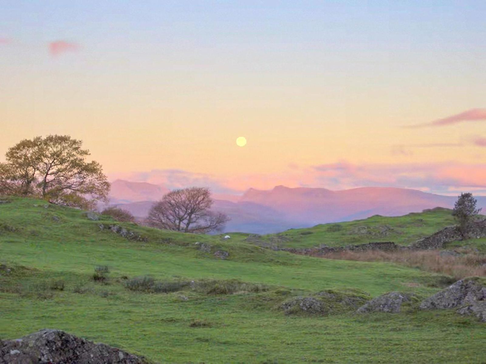 Sun setting over Lakeland fells near Windermere